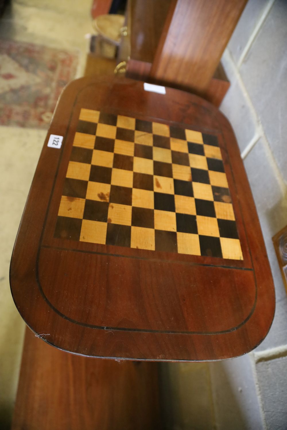 A mahogany tripod games table, width 61cm, depth 40cm, height 72cm